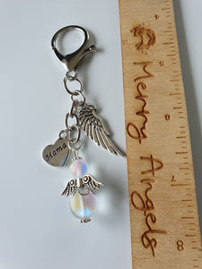 This is a picture of a silver angel keyring with two silver charms (angel wing and heart with 'mama' engraved on it)