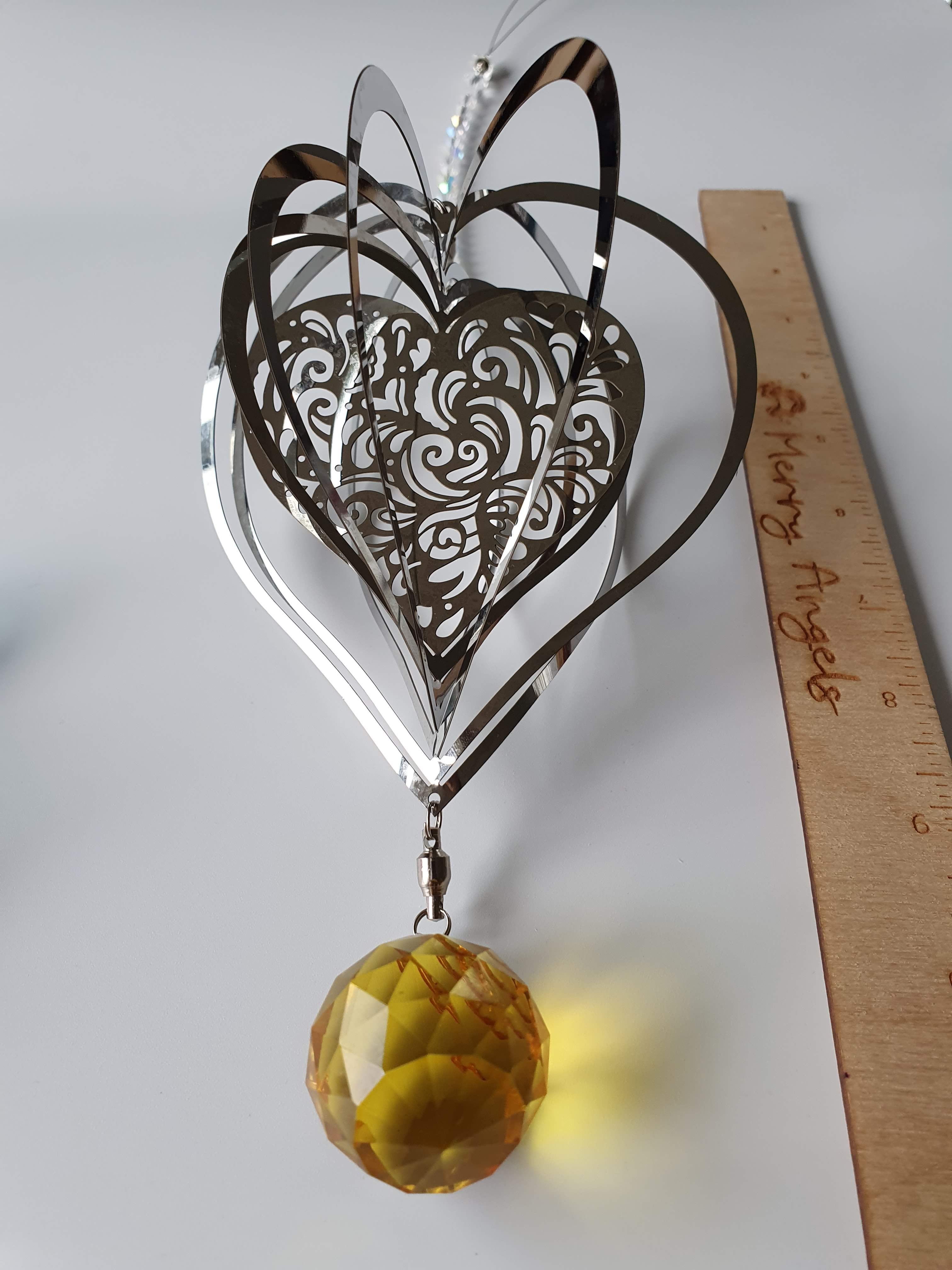 Heart shaped wind spinner with yellow glass crystal
