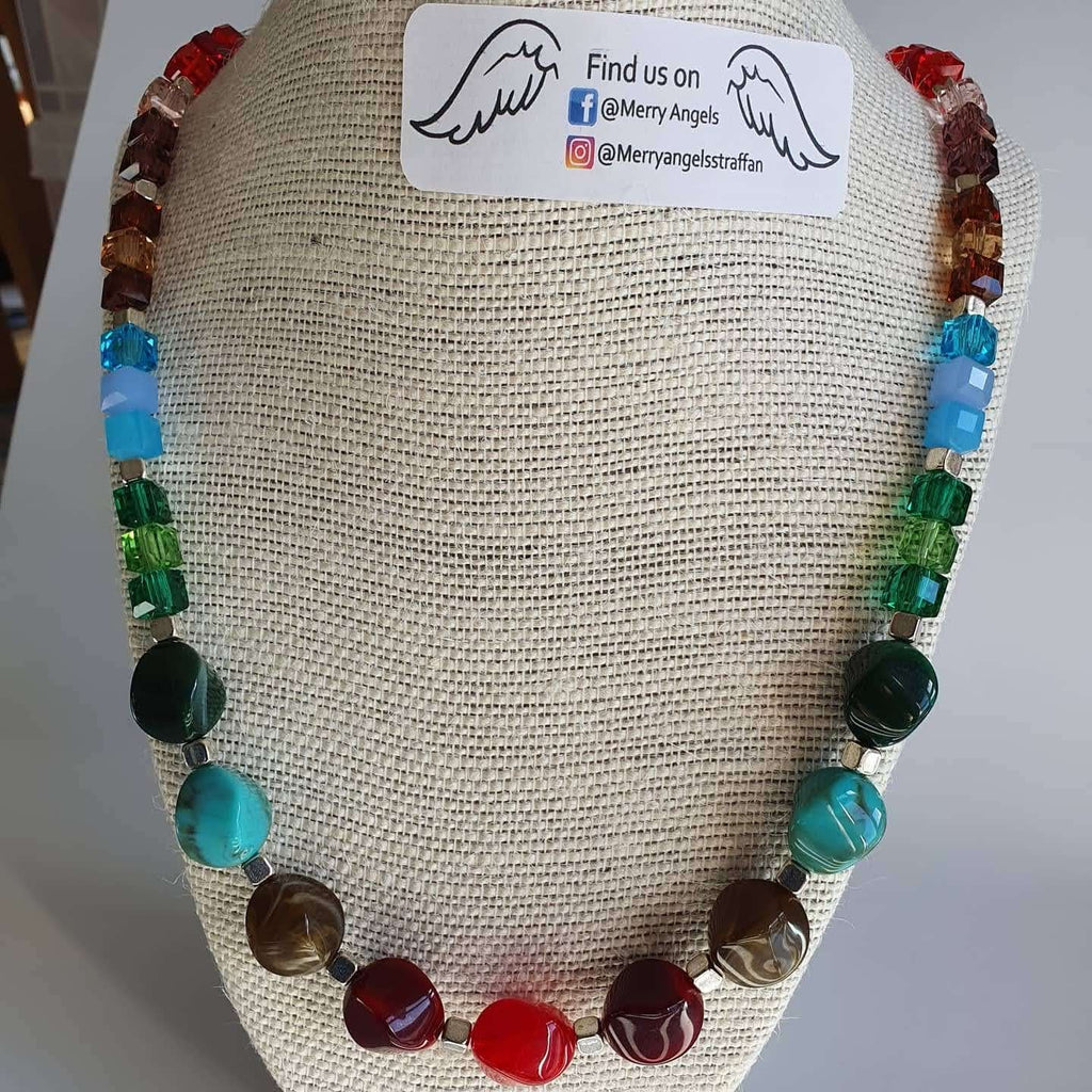 This is a picture of a beautiful rainbow necklace with circle and cube beads
