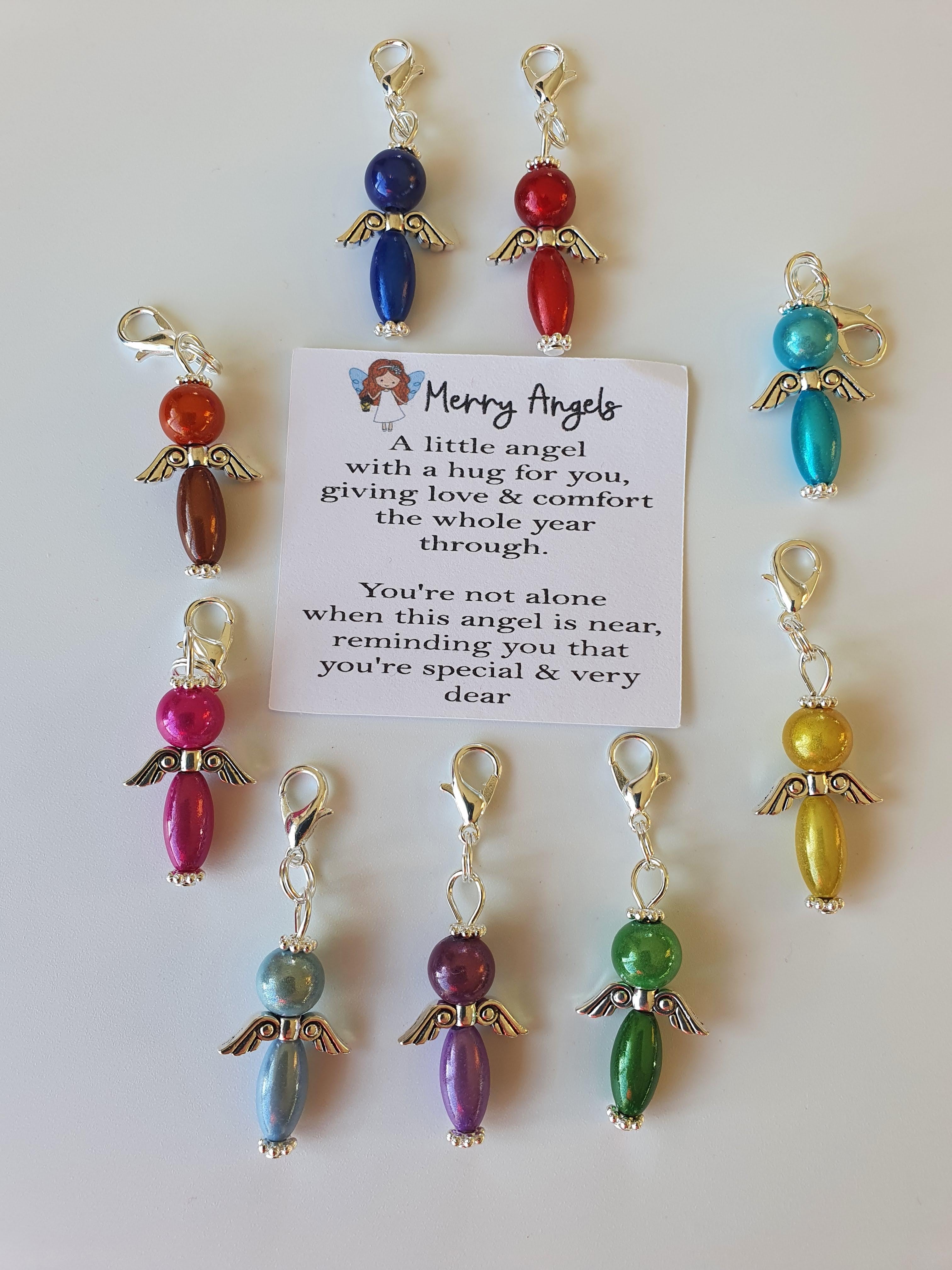This is a picture of 9 angel hugs laid out around a poem about angels. The angel hugs are in a variety of colours including: blue, red, yellow, green, purple, pink 