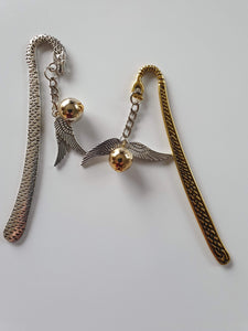 This is a picture of one silver and one gold angel wings bookmarks