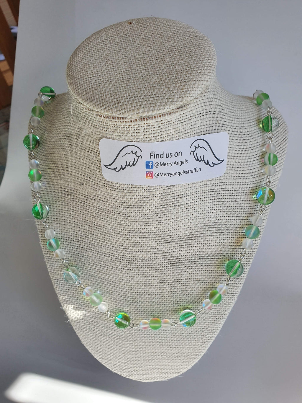 This is a picture of a beautiful green and clear necklace