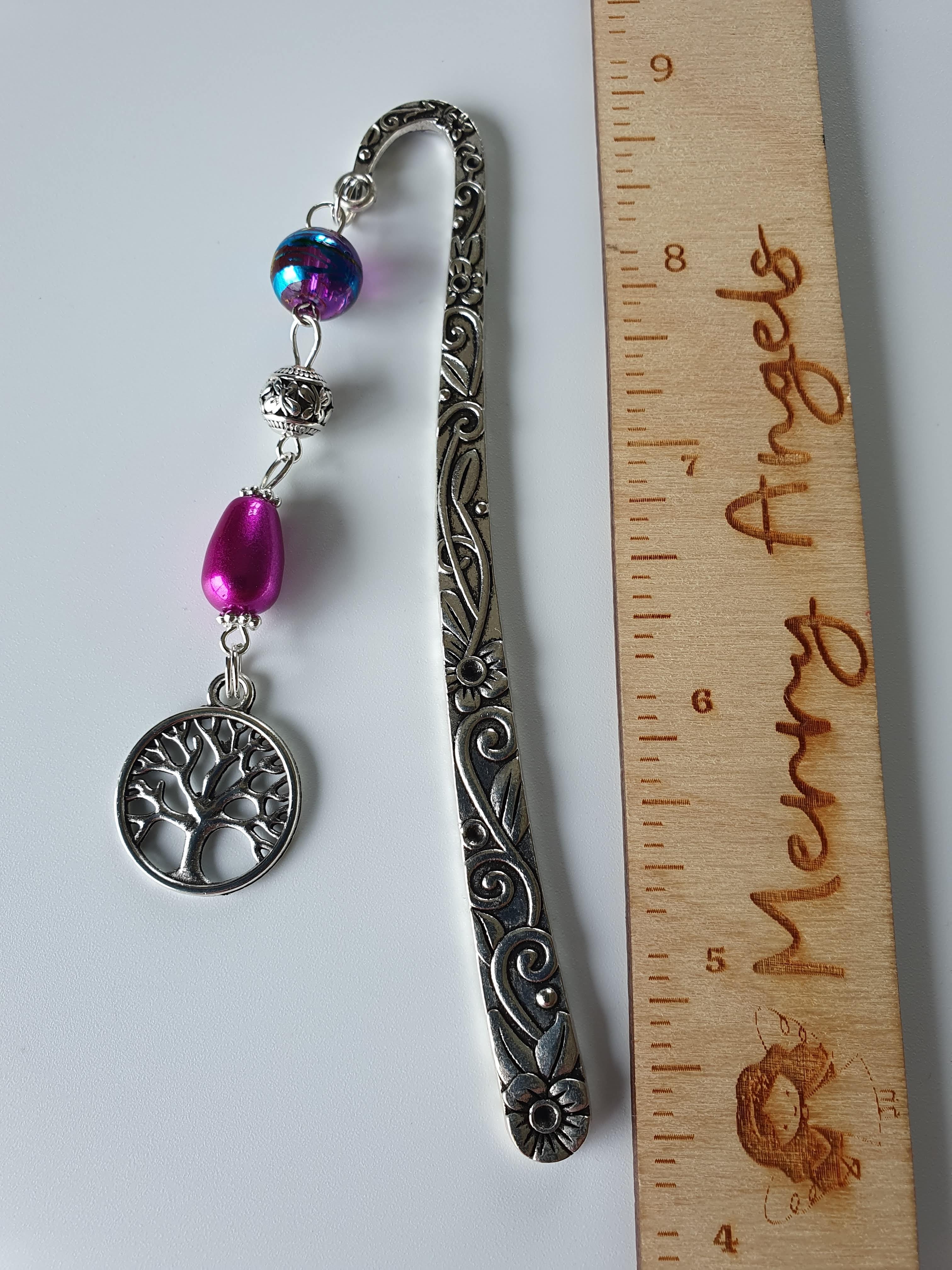 Silver tree of life bookmark with pink beads.