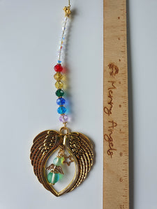 This is a picture of a gold rainbow beads angel wing hanging charm