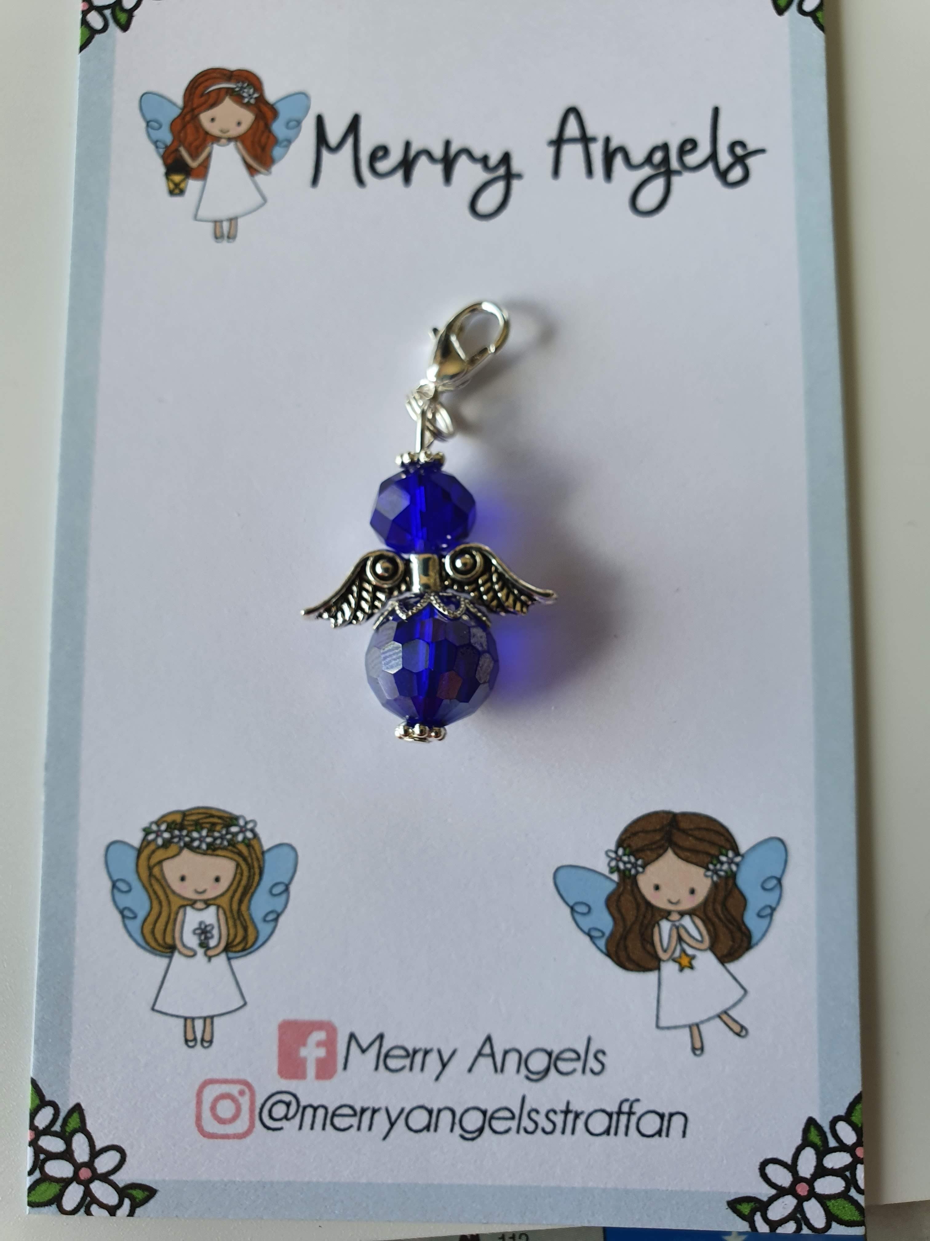 This is a picture of a blue angel hug on a piece of card