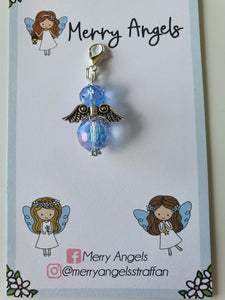 This is a picture of a baby blue angel hug on a piece of card