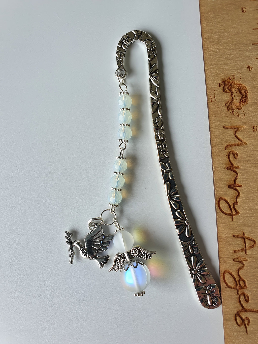 Beautiful silver bookmark with a confirmation dove charm and clear angel