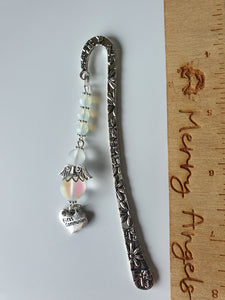 Beautiful silver bookmark with a first communion heart charm and clear angel