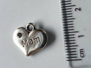 Silver charm with 'Mam' engraved on it