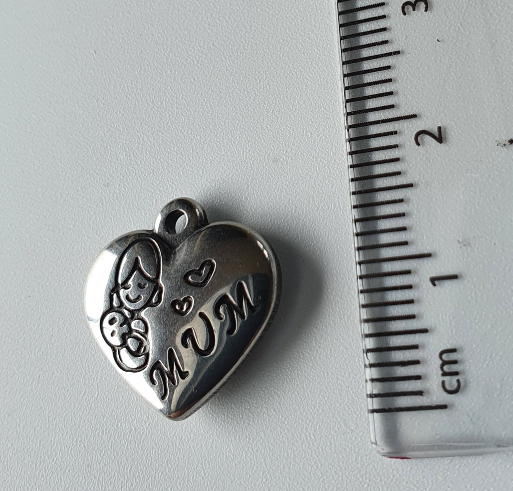 Silver charm with 'mum' engraved on it, and another engraving of a mum holding a baby