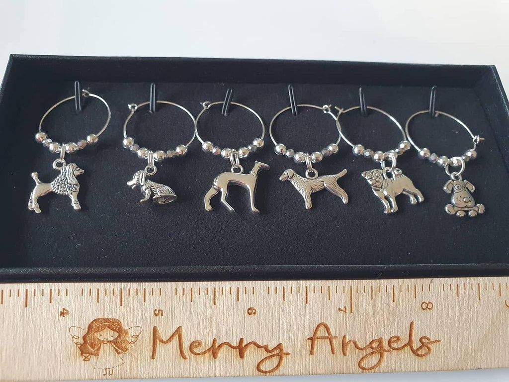 This is a picture of 6 dog wine glass charms