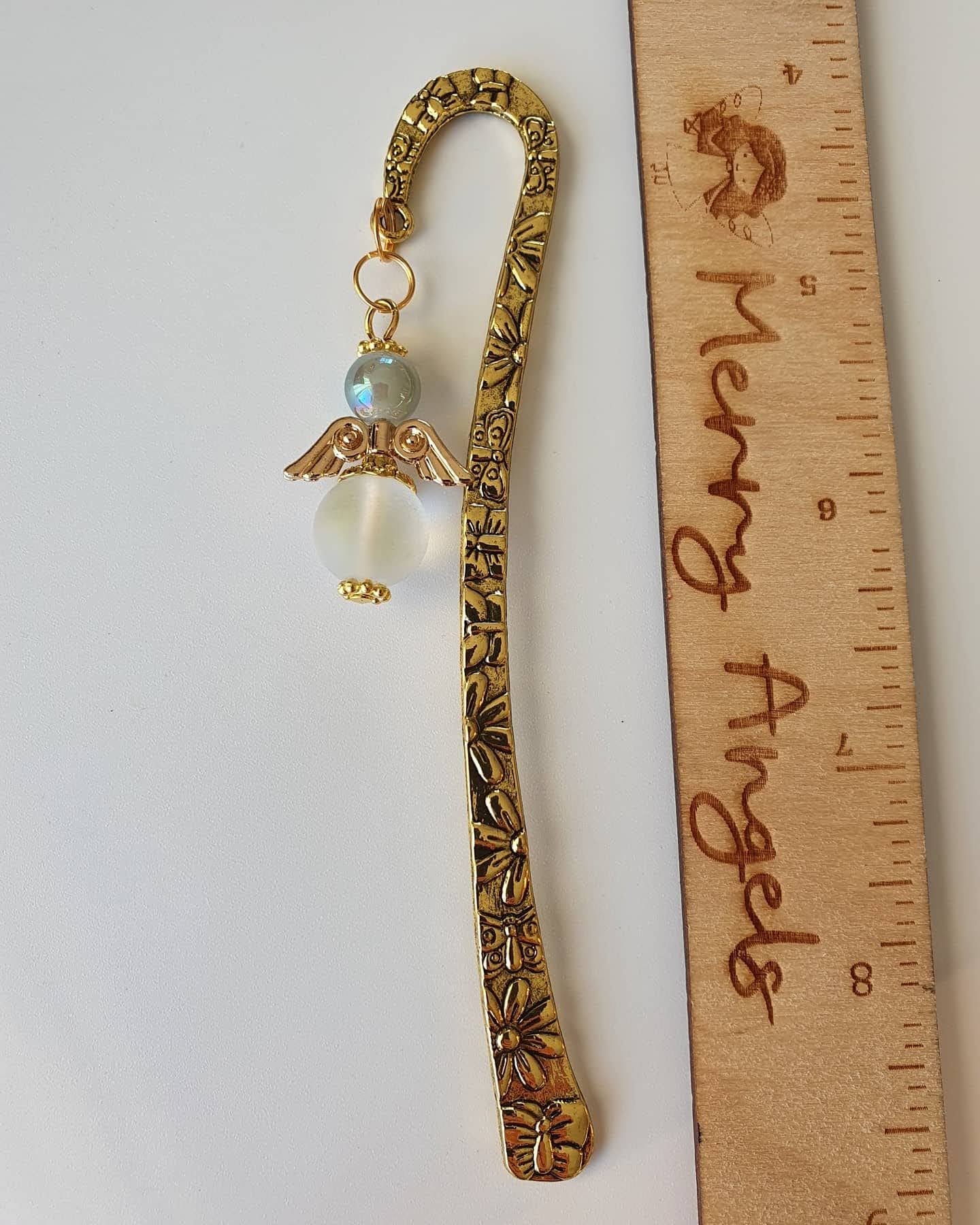This is a picture of a gold angel bookmark