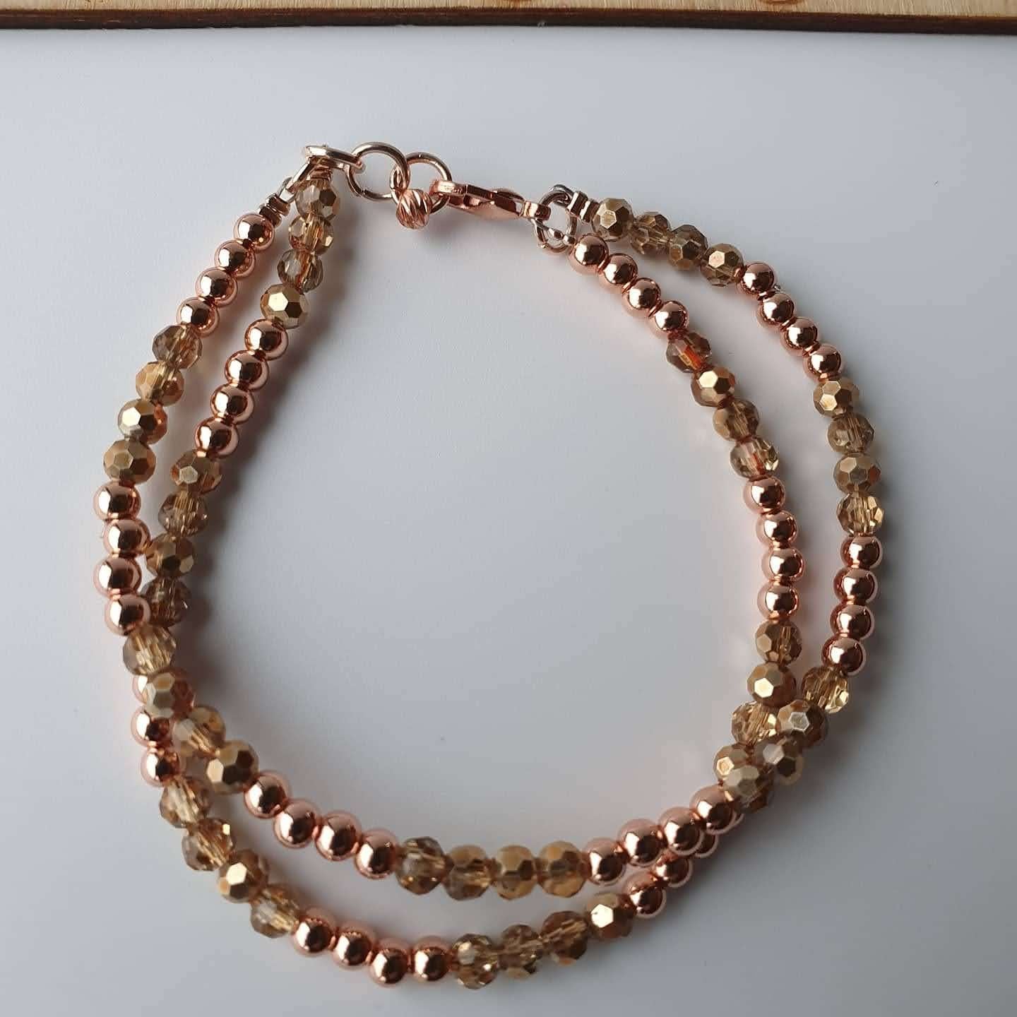 This is a picture of a gold and rose gold bracelet 