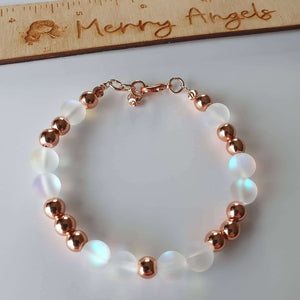 This is a picture of a rose gold and clear bracelet