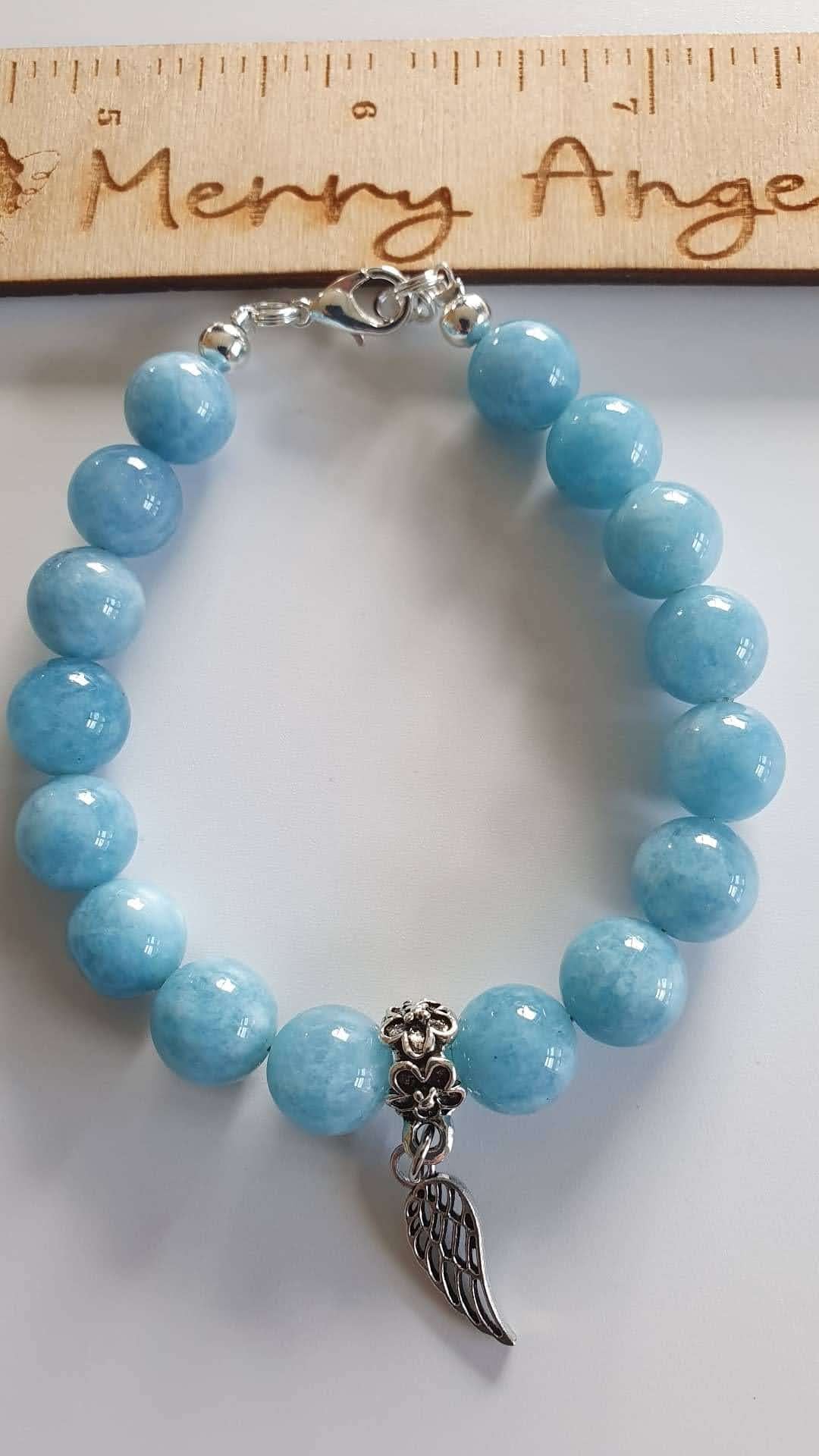 This is a picture of a blue angel wing bracelet