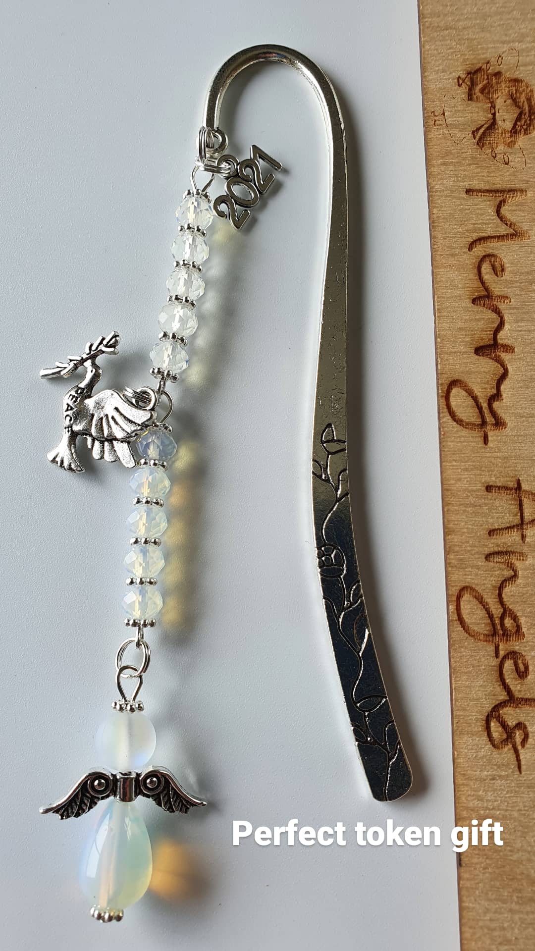 Beautiful silver bookmark with a confirmation dove charm, a 2021 charm, and a clear angel