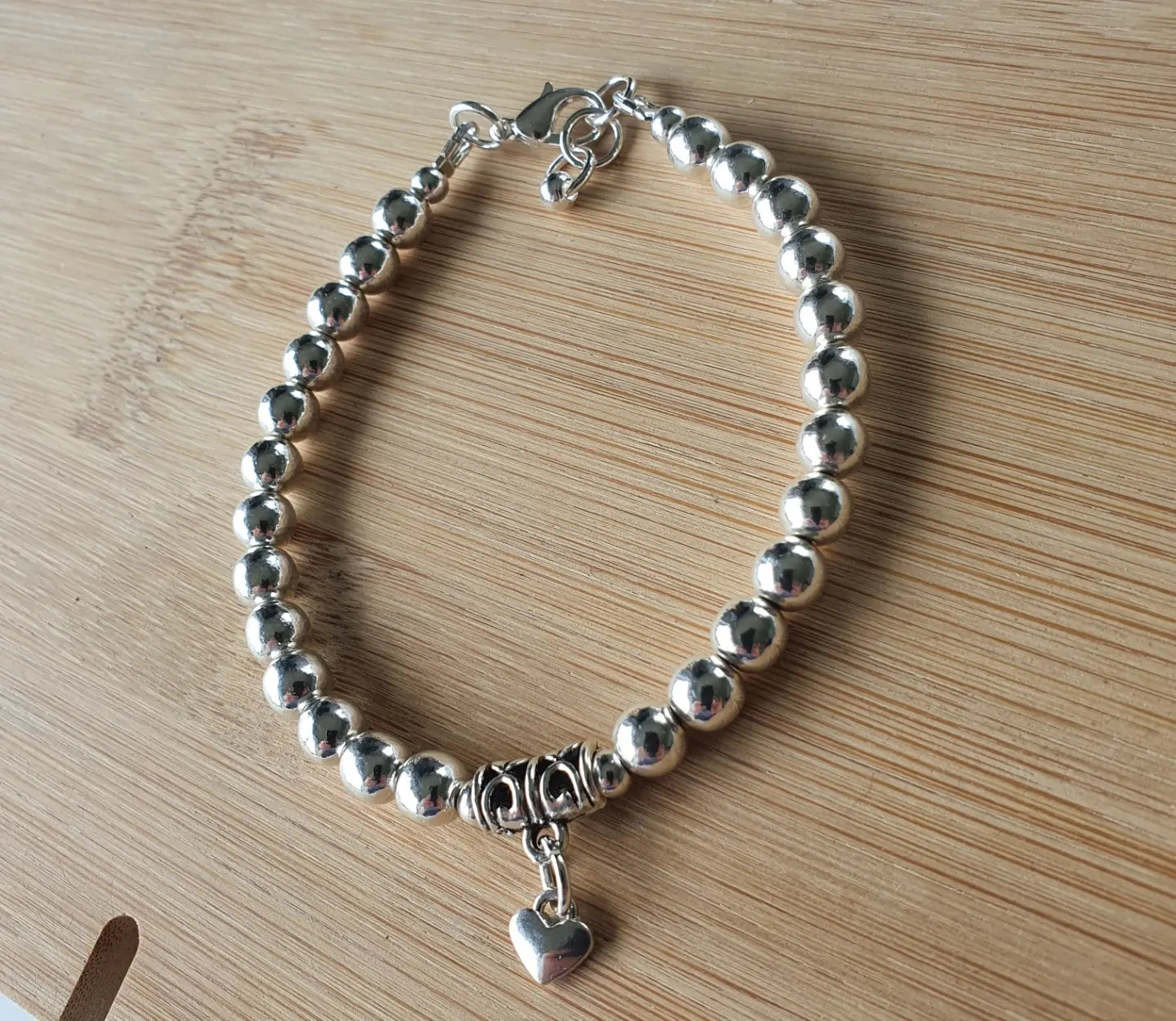 Silver coloured heart bracelet